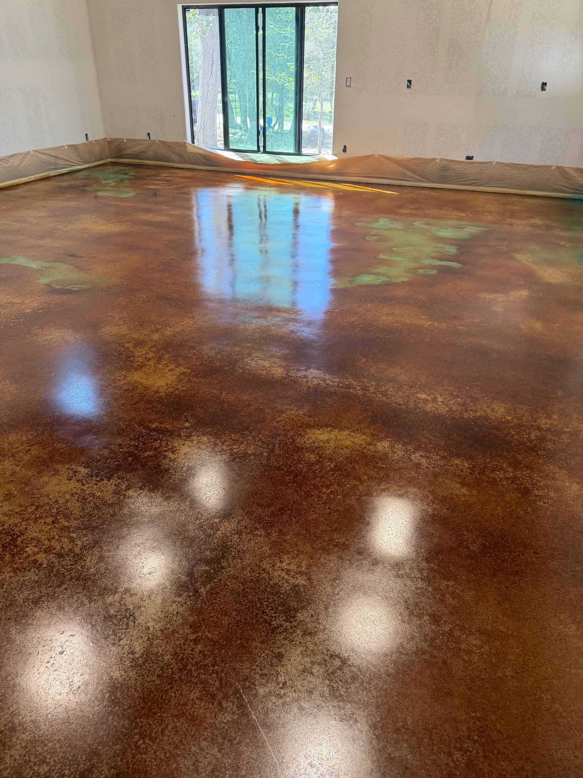 Acid Stained Concrete Floor with Aqua and Cola Colors image