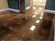 Glossy polished concrete floor in modern interior space with natural light.
