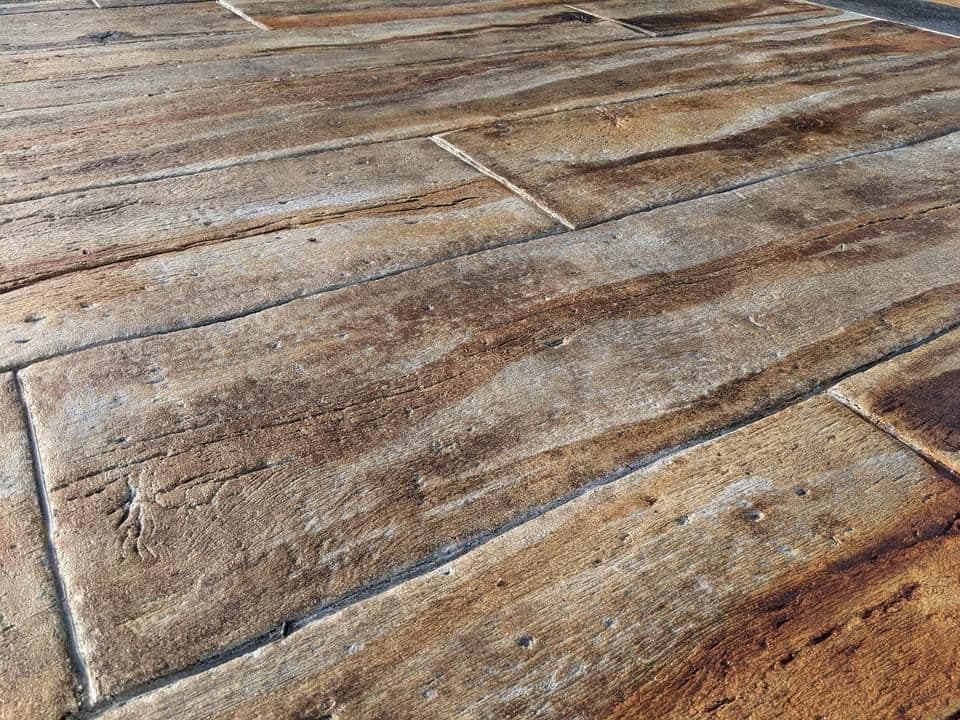 Textured wooden flooring with weathered planks and natural color variations. Ideal for interior design.