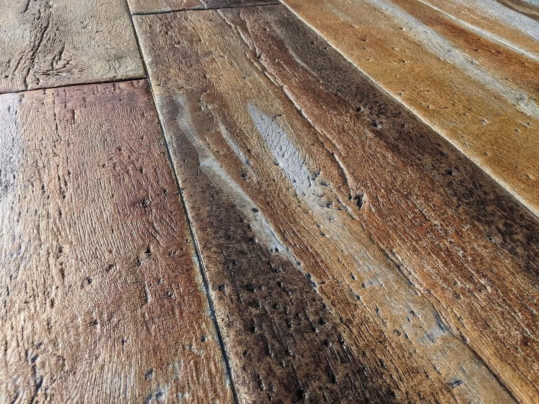 Close-up of rustic wooden flooring with rich textures and natural grain patterns.
