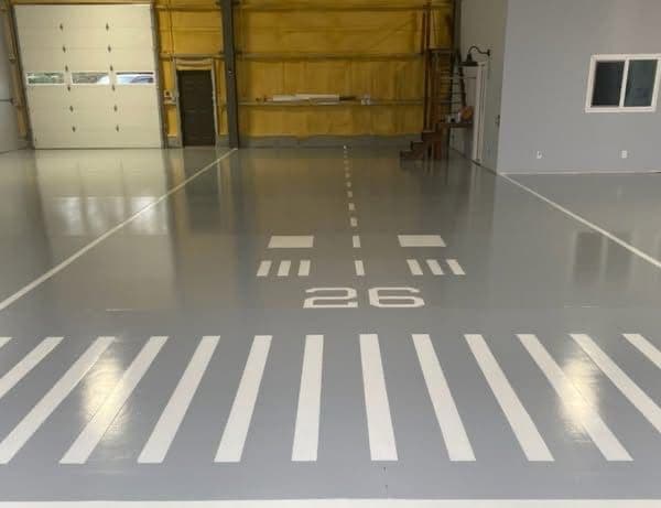 Gallery photos for Custom Runway-Themed Epoxy Floor in a Private Hangar: Image #2