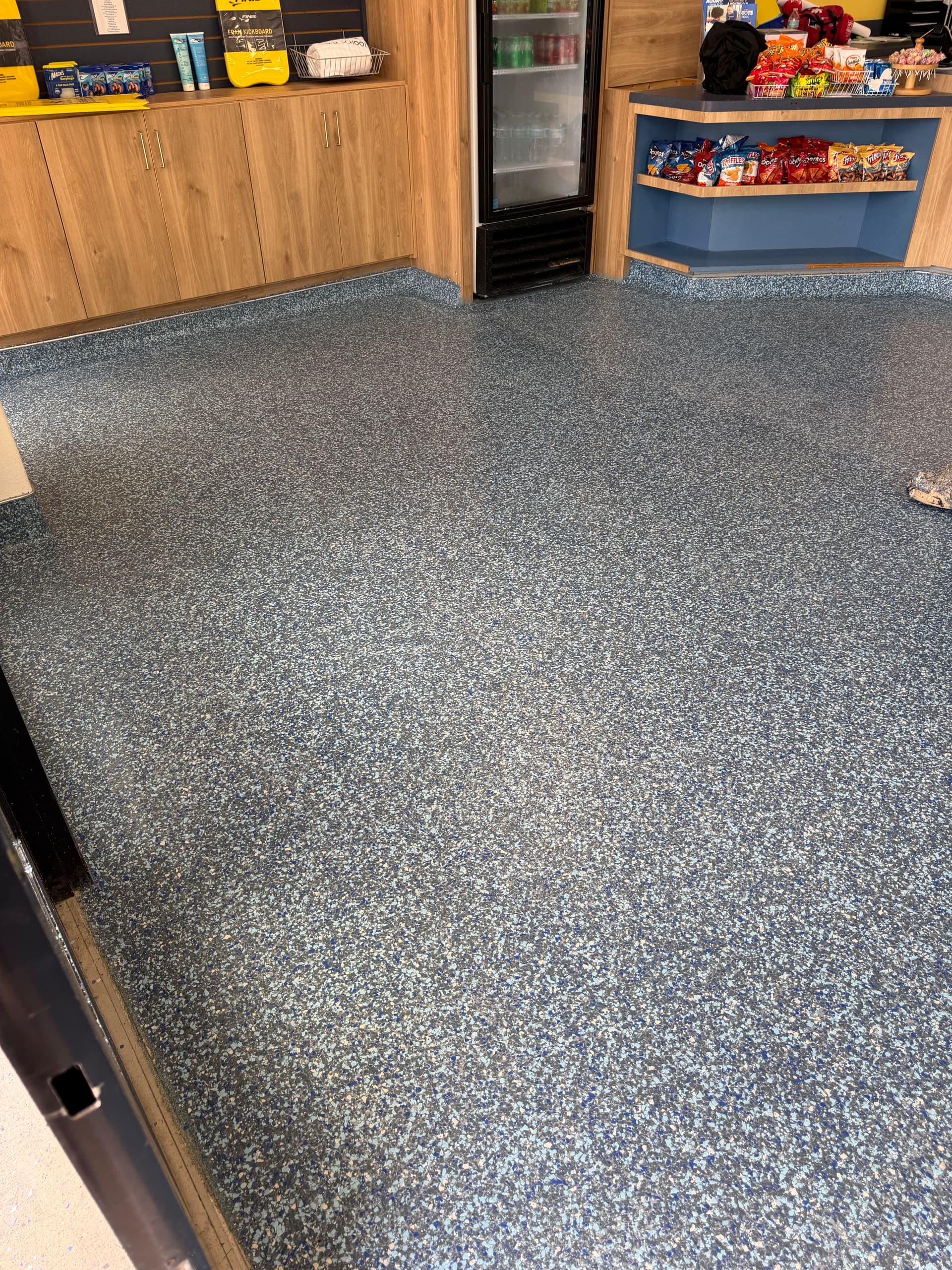 Gallery photos for Flake Epoxy Flooring with Cove Base at Aqua-Tots Swim School: Image #1