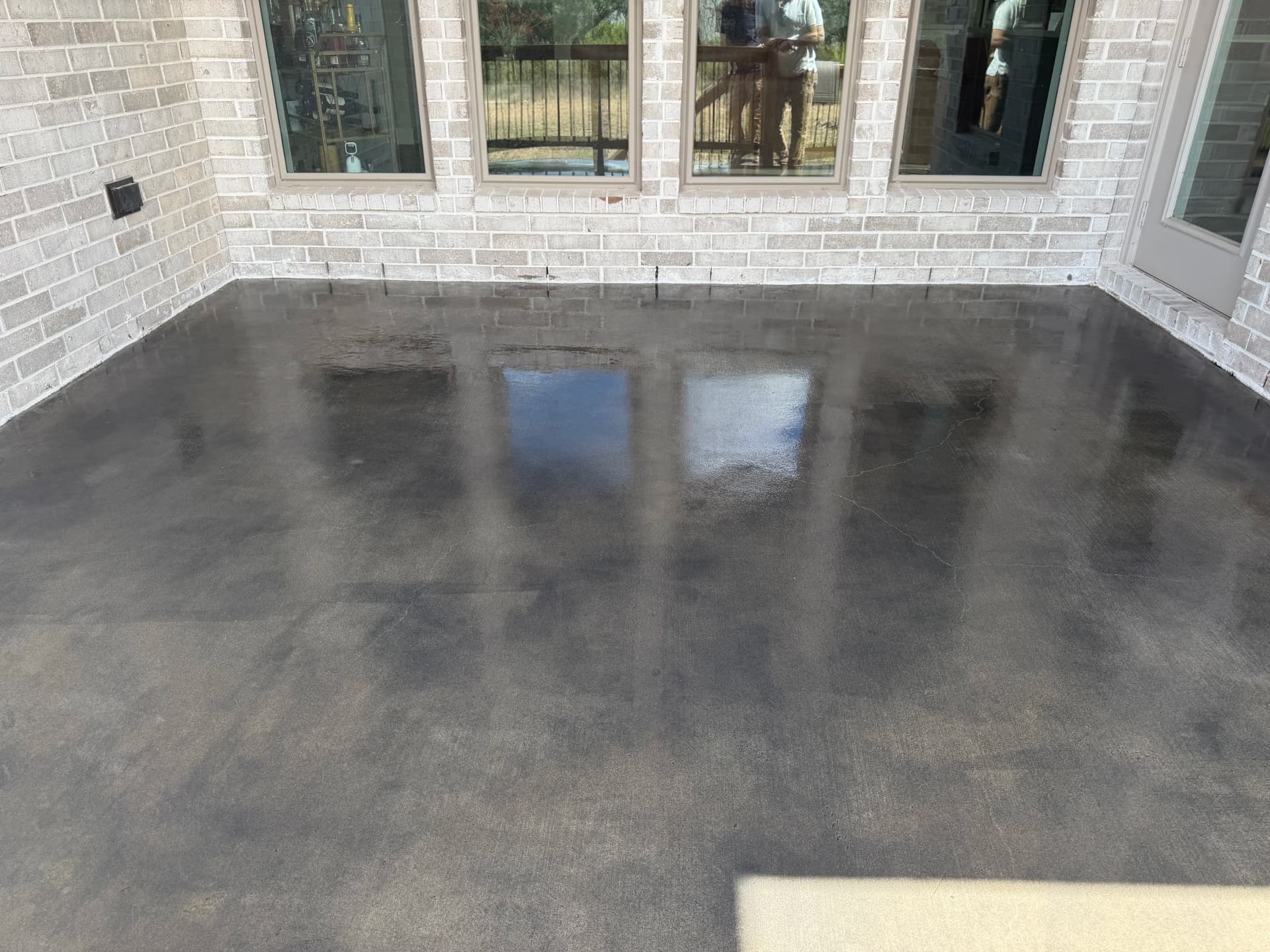 Smoke Grey Stained Concrete Patio with Industrial Sealer image