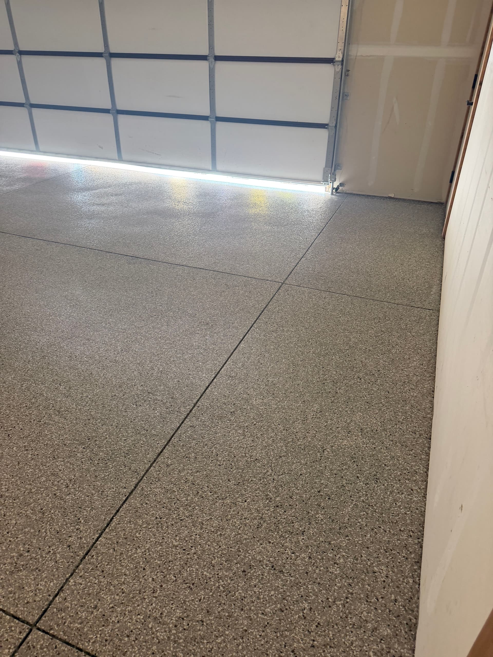 Gallery photos for Creekbed Flake Epoxy Gives This Garage Floor a Sharp Finish: Image #1