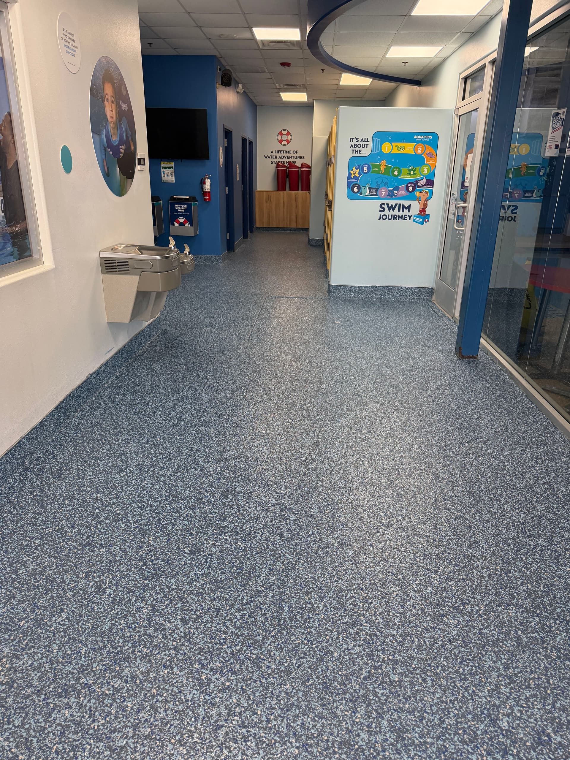 Gallery photos for Flake Epoxy Flooring with Cove Base at Aqua-Tots Swim School: Image #5
